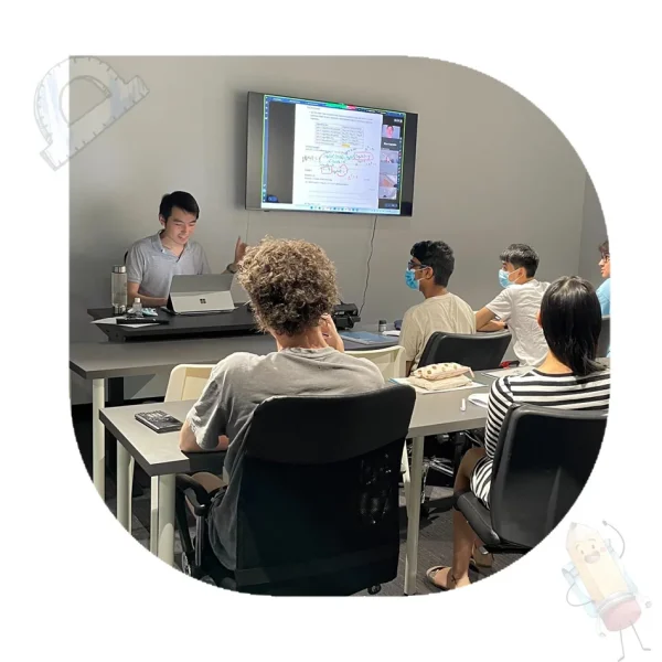 Rob teaching a VCE tutoring class at EdAtlas, using interactive notes on-screen with engaged students in a classroom setting